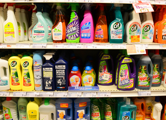 Colorful cleaning products on a grocery shelf, illustrating how Neil Harbisson, a human cyborg standing nearby, will hear a symphony of sounds via his eyeborg. (Photo © Meredith Mullins)