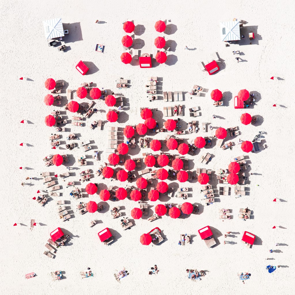 "Red District," image of red umbrellas and beach chairs on Miami Beach, from a creative photography series taken by Antoine Rose, whose creative process relies on the bird's-eye view (Image © Antoine Rose)