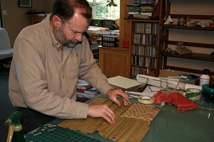 Origami artist Robert Lang engaged in his creative process. (Image © Robert Lang)