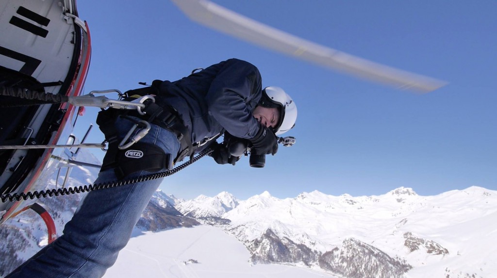 Antoine Rose tethered to a helicopter while shooting bird's-eye view photographs for his creative photography series "Up in the Air."  (Image © Simon Cramar)