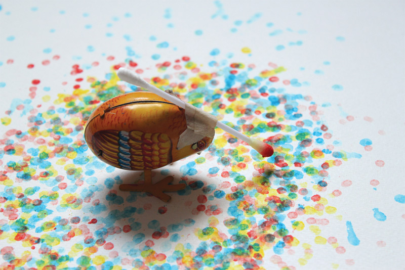 Artwork being created by a tin toy showing how wind-up toys can unleash creative expression. (Image © Echo Yang)