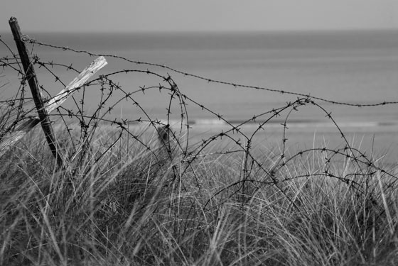 Barbed wire at Omaha Beach in Normandy, site of the D-Day invasion and the longest day, where Life's choices made a difference (Photo by David hughes/iStock)