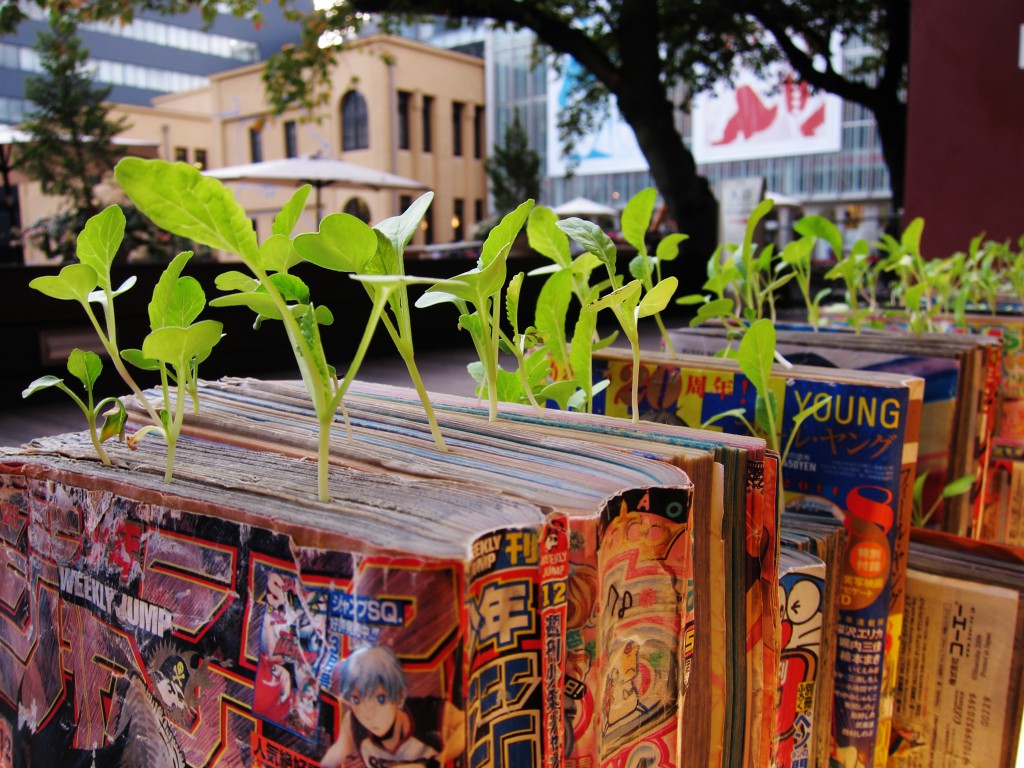 Radishes growing from the pages of a Japanese manga comic book, accomplished through the creative process of Koshi Kawachi (Image © Koshi Kawashi)