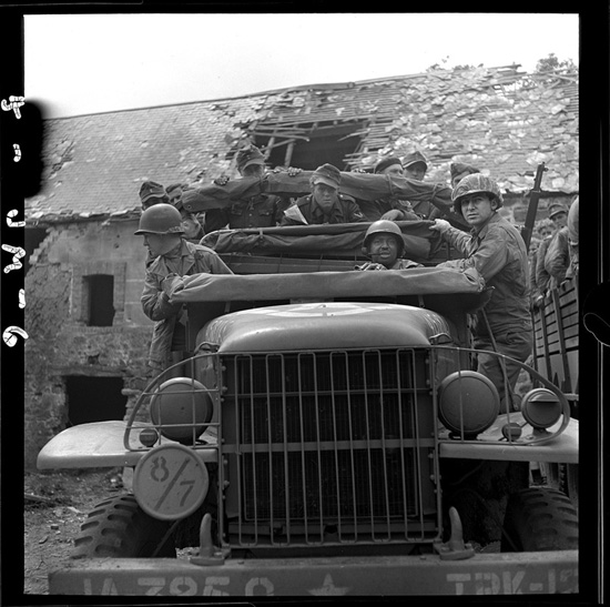 Transport of German prisoners by American soldiers, near Saint-Lo France, after the D-Day invasion on the longest day, where life's choices made a difference (Photo © John Morris/Contact Press Images).