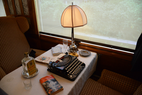 A typewriter in the club car of The Orient Express, a train that offered life-changing experiences to travelers crossing two worlds. (Photo © Meredith Mullins)