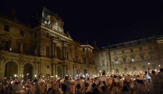 Sparklers at the Dîner en Blanc at the Louvre, a way to live life to the fullest. (Photo © Meredith Mullins)