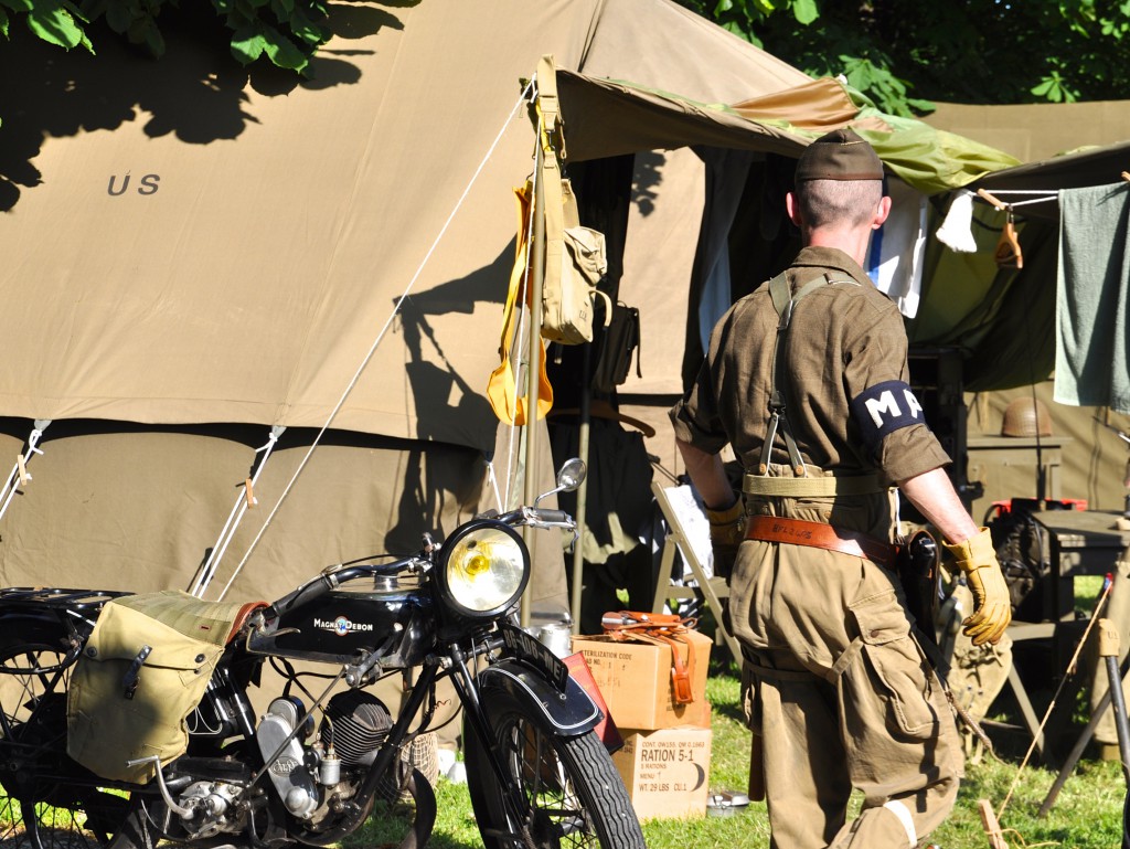 Frenchmen, dressed like American soldiers, re-enact life in a military camp, providing a unique cultural encounter for  visitors to the 70th anniversary of D-Day. (Image © Sherry Long)