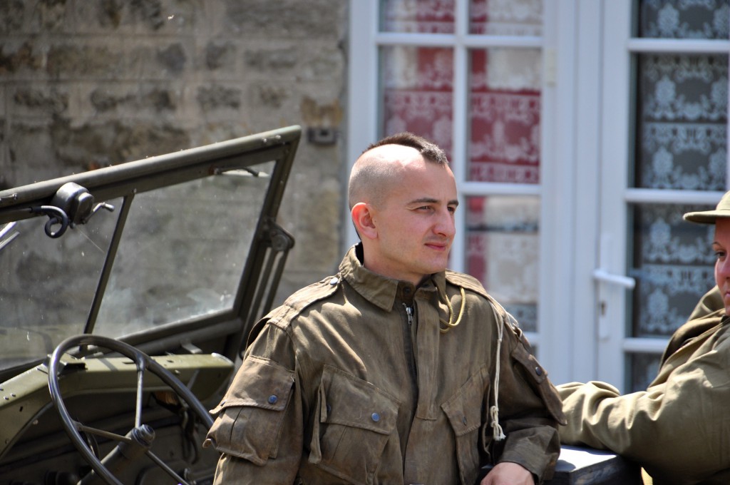 Frenchman impersonating a "Filthy Thirteen" paratrooper, visits the American military camp reconstructed for the D-Day 70th Anniversary commemoration of one of the great moments in history. (Image © Sheron Long)
