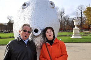 Two adults showing an emotional connection with inspiring art as they make the same face as a funny sculpture of a giant head by Ugo Rondinone. (Image © Erick Paraiso)