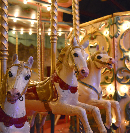 Three carved horses on a carousel, creative expression via funfairs at the Musée des Arts Forains (Photo © Meredith Mullins)