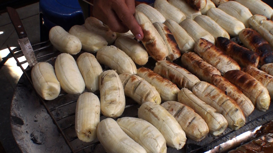 BBQ bananas in Thailand, representing cultural encounters and uses of bananas around the world (Photo © Ryan White)