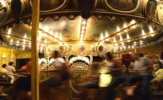 The Vélocipèdes carousel in motion, creative expression at fun fairs shown at the Musée des Arts Forains in Paris. (Photo © Meredith Mullins)