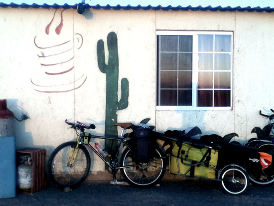 Bicycle by house in Mexico, part of the life lessons offered on an adventure cycling trip with the dogs of Mexico (Photo © Eva Boynton)
