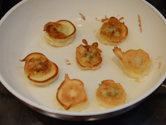 Fried bananas in a pan, representing cultural enounters and uses of the banana around the world. (Photo © Meredith Mullins)
