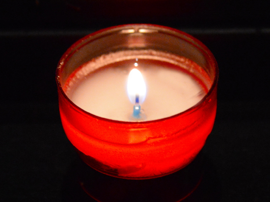 Red candle, a tribute to the Virgin Mary on Fête des Lumières, a festival of light installations showing the art of light. (Photo © Meredith Mullins)