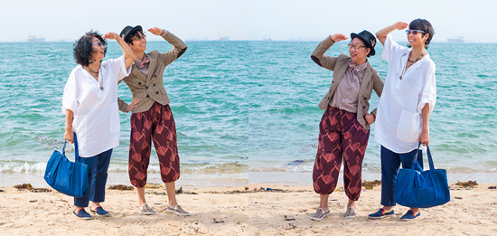 A chinese mother and daughter swap clothes on the beach in a generation gap experiment of conceptual photography by Qozop (Photo © Qozop)