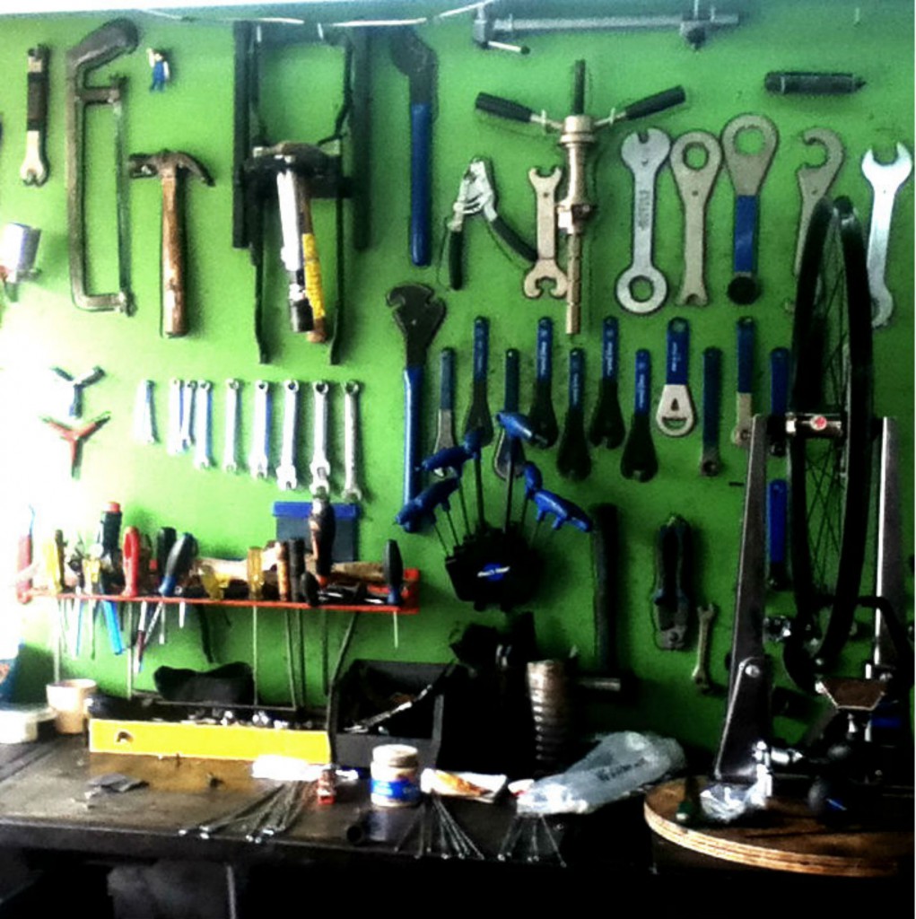 Tools in a communal workspace inside a bike co-op, illustrating one way the co-ops build a community as part of their cyclist movement. (Image © Eva Boynton)