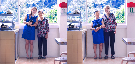 Chinese grandmother and grand-daughter in kitchen swapping clothes for a generation gap experiment of conceptual photography by Qozop (Photo © Qozop)