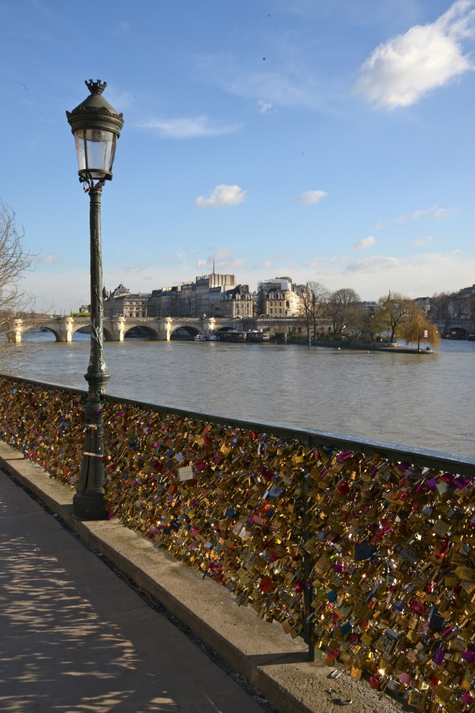 View from the Pont des Arts today, showing the arrival of love locks and a new kind of romance in Paris and answer to "Can Love Conquer All" (Photo © Meredith Mullins)