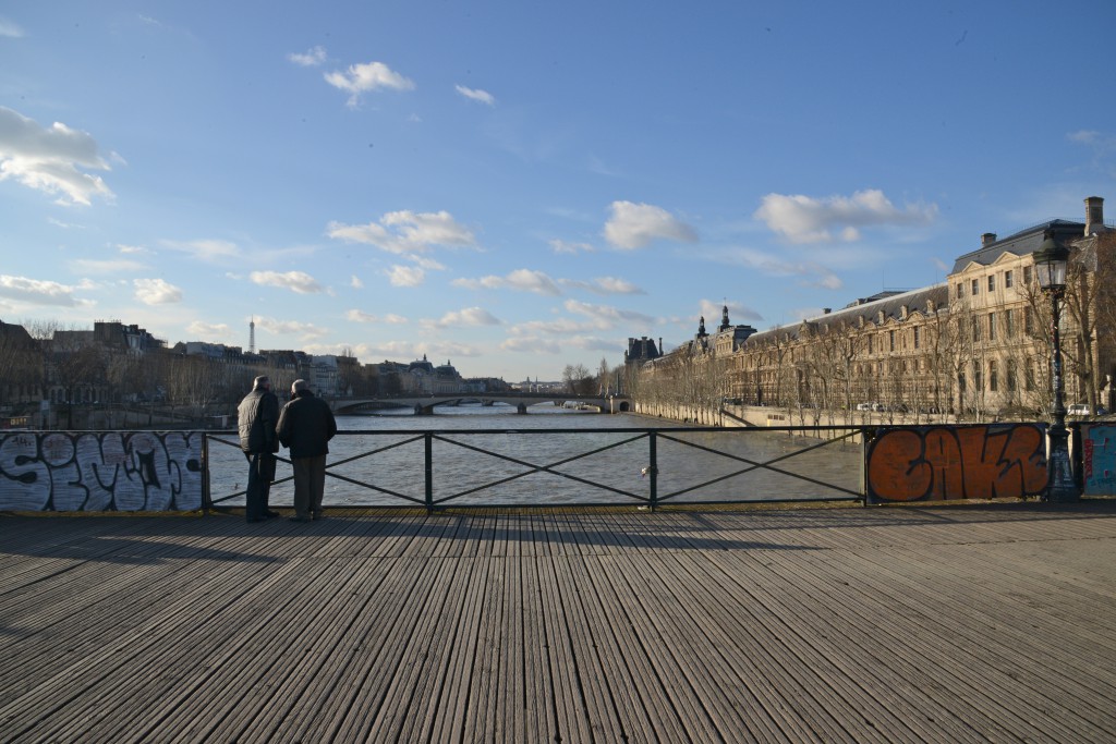 Clear panels on the Pont des Arts, preventing love locks and paying tribute to romance in Paris and the idea of "Can Love Conquer All?" (Photo © Meredith Mullins)