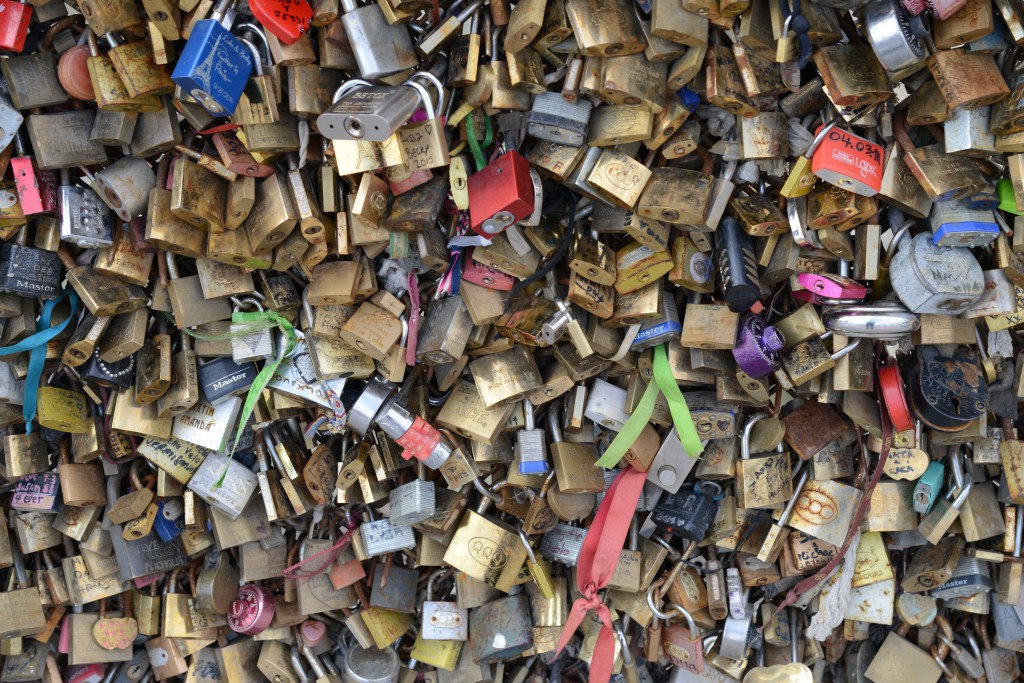 Love locks on the Pont de l'Archeveché, a tribute to romance in Paris and the idea of "Can love conquer all?" (Photo © Meredith Mullins)