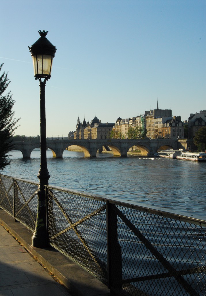 Pont des Arts in Paris showing the view before lock locks, the real version of romance in paris and the idea of "can love conquer all" (Photo © Meredith Mullins)