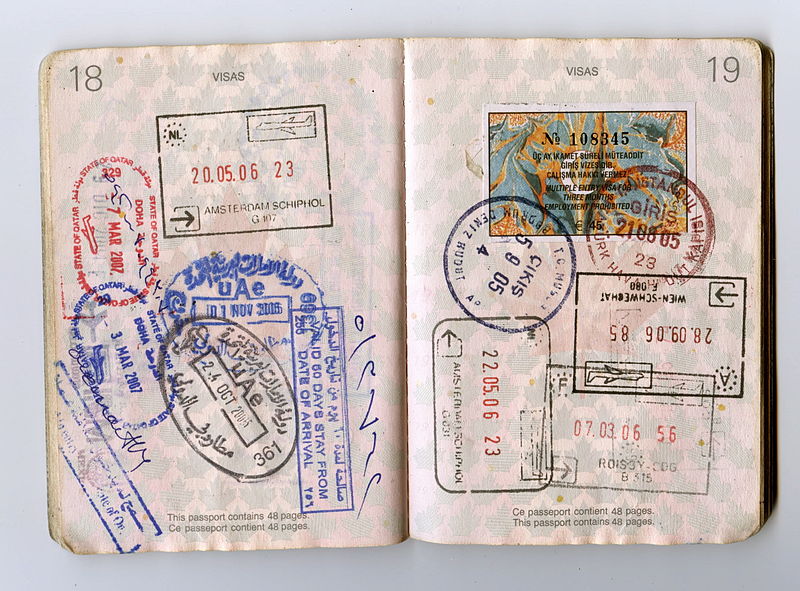 Passport book open with overlapping stamps, showing what the travel ninja lost and found (image © Jon Rawlinson