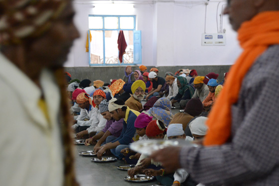 Sikh Temple langar in Delhi, cultural encounters in Northern India that provide travel inspiration. (Image © Meredith Mullins)