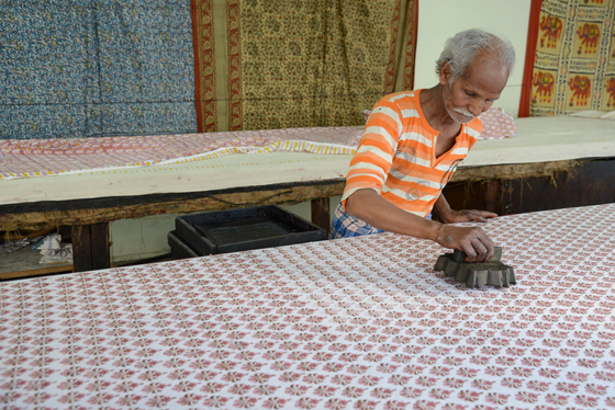 Block printer in Jaipur, cultural encounters in Northern India that provide travel inspiration.  (Image © Meredith Mullins)