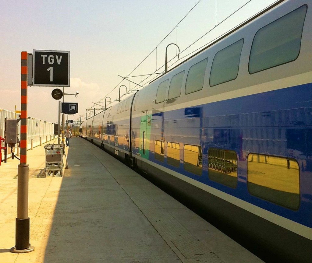 TGV train stopped at a station, illustrating the journey of a travel ninja that led to travel tips for what to do when you lose everything. (Image © Sheron Long)