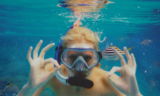 Snorkeler in water, part of the virtual vacation in Southeast of Zilla van den Born, inspired by wanderlust. (Image © Zilla van den Born)