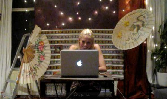 Zilla van den Born at her computer on her virtual vacation in Southeast Asia, inspired by wanderlust (Image © Zilla van den Born)