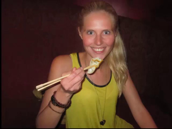 Zilla van den Born eating with chopsticks on her virtual vacation in Southeast Asia, inspired by wanderlust. (Image © Zilla van den Born)