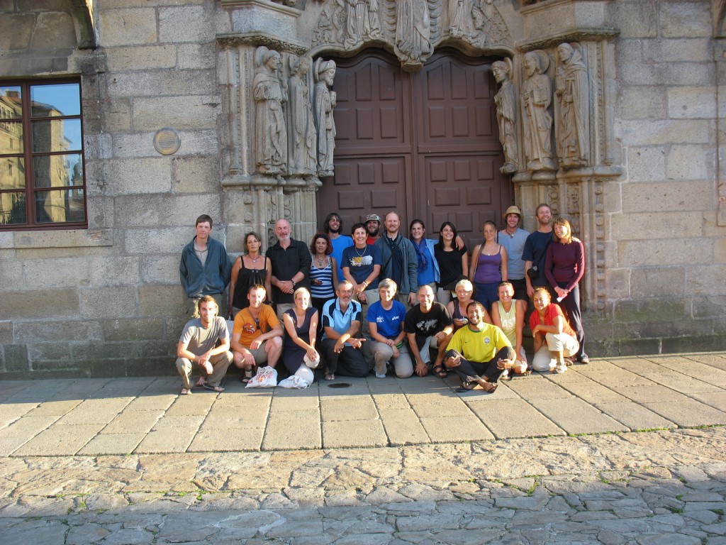 A group of pilgrims, whose travel inspiration took them down the Camino de Santiago for very different reasons, in front of the Cathedral at the end of the route. (Image © Jenna Tummonds)