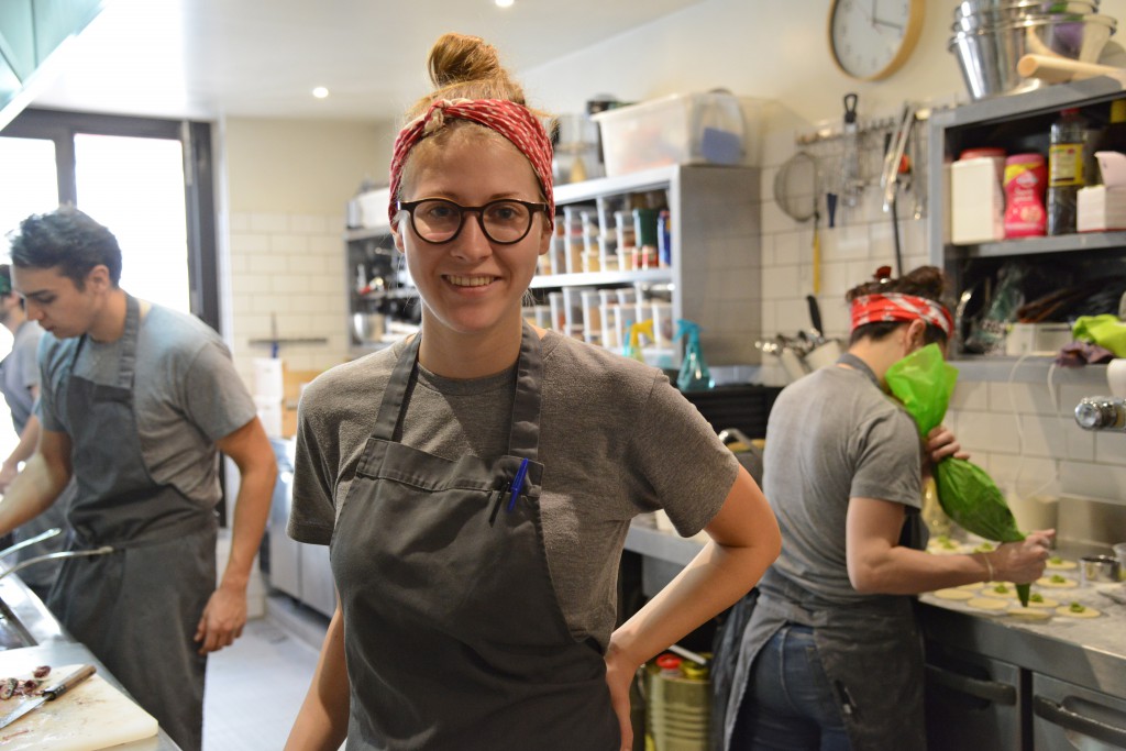 Hannah Kowalenko at Ellsworth restaurant, showing the focus on food of French sayings. (Image © Meredith Mullins)