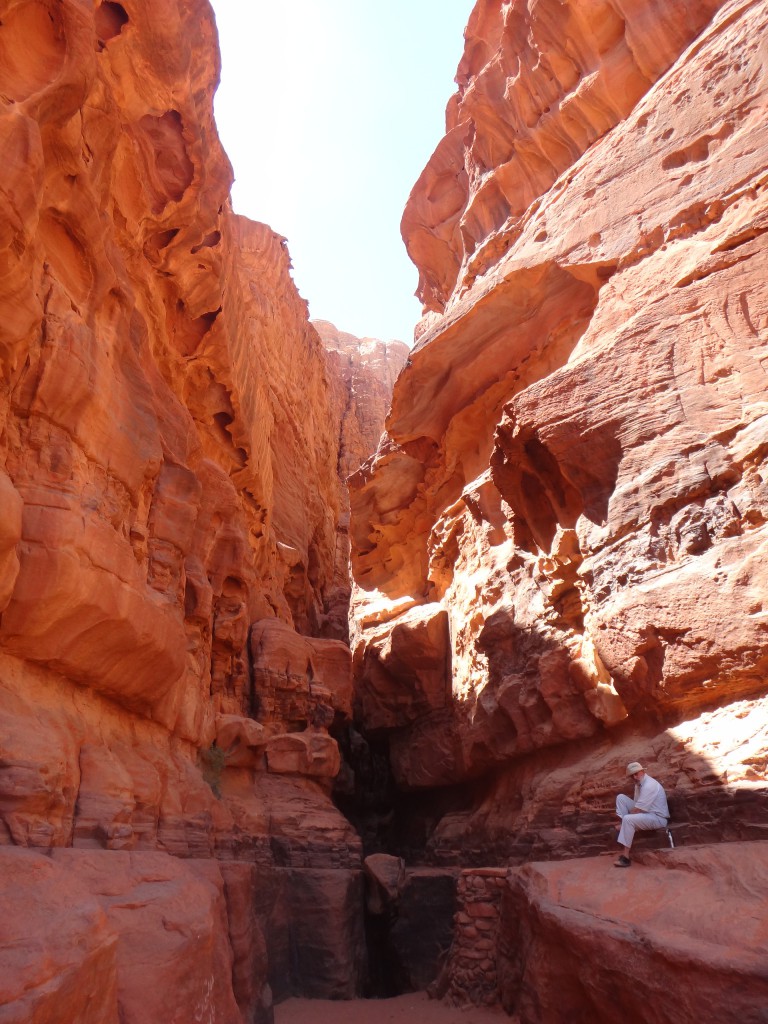 A golden-red canyon in Wadi Rum, Jordan illustrating a barrier as large as the cultural barriers that some travelers to the Middle East may feel are in place. (Image © Sally Baho)