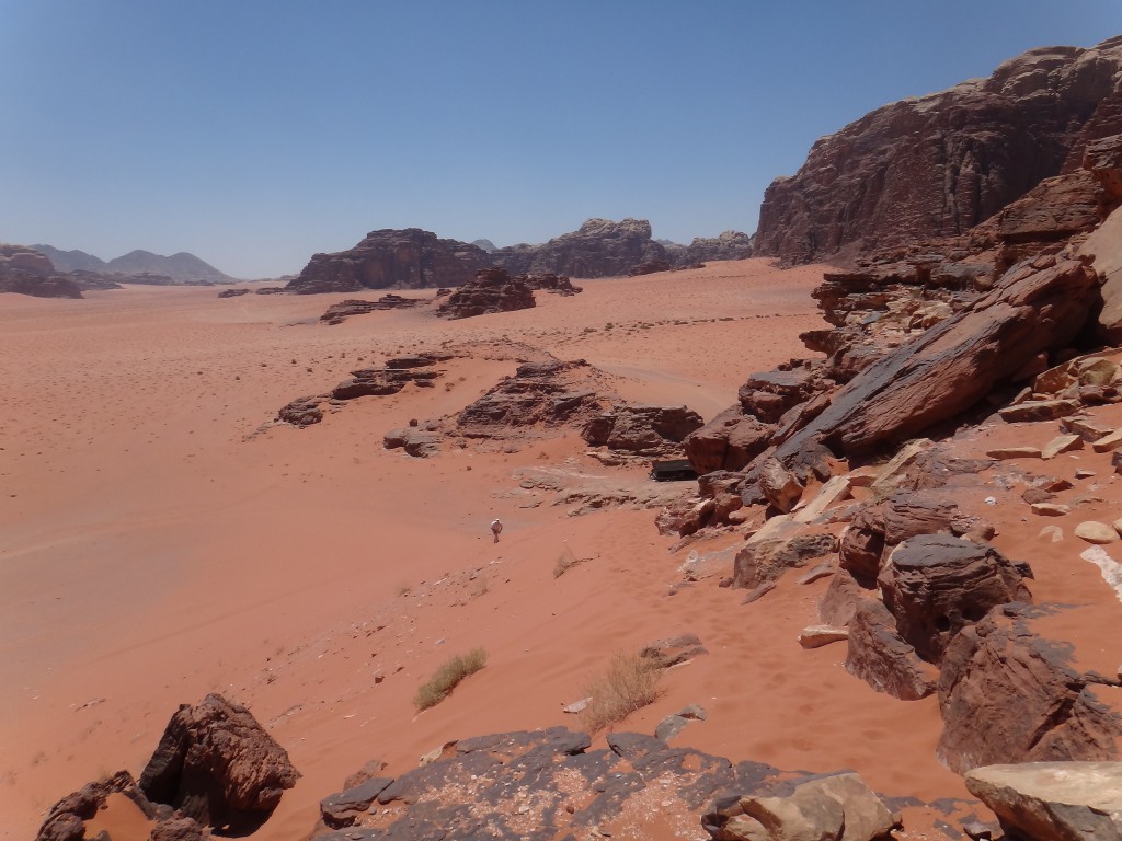 Orange and red sand desert in Wadi Rum, where a traveler can  experience bridging cultural barriers with Bedouin people. (Image © Sally Baho)