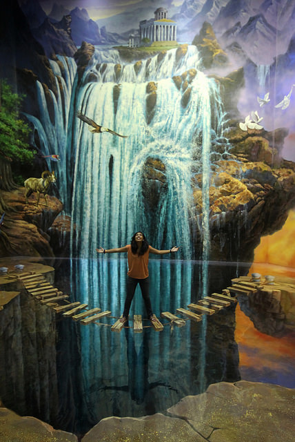 Woman under waterfall in a 3D interactive painting, providing rich opportunities for selfies at the 3D interactive Art in Island Museum in the Philippines. (Image © Edgar Alan Zeta-Yap.)