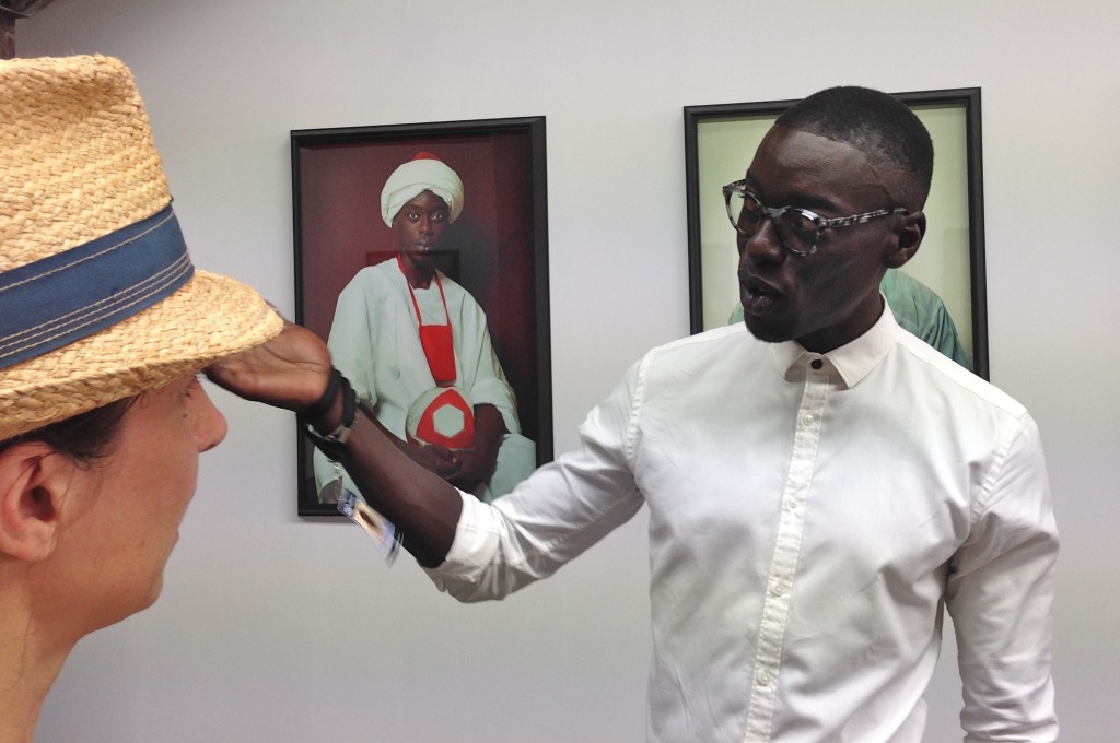 Omar Victor Diop at the Rencontres d'Arles exhibit, showing his portrait photography based on the cultural history of Africa. (Image © Meredith Mullins.)