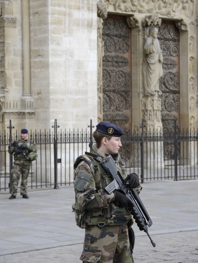 French soldiers guard Notre Dame after the Paris attacks, which brought out the best of French cultural beliefs in the aftermath. (Image © Meredith Mullins.) 