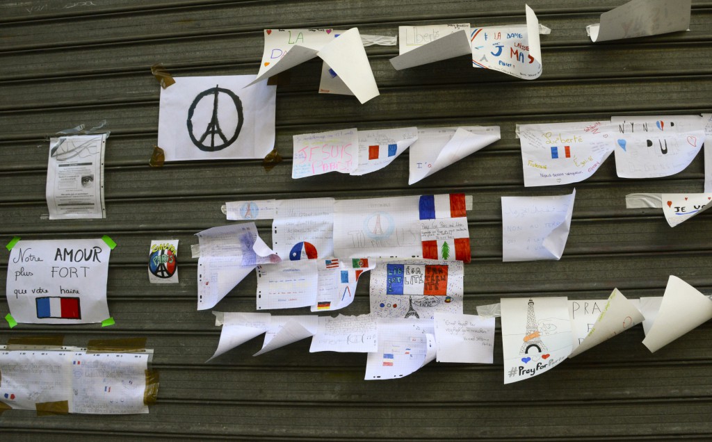 Signs on Le Petit Cambodge showing French cultural beliefs in the wake of the Paris attacks. (Image © Meredith Mullins.)