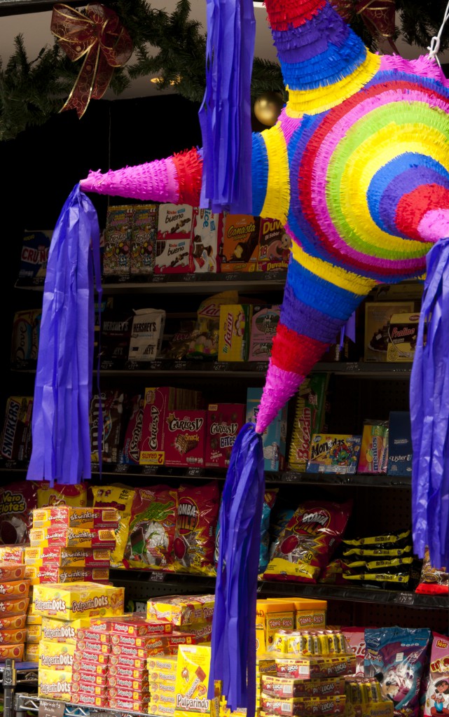 Piñata in Mexican grocery store, one of the holiday traditions that shows cultural differences. (Image © Lorena Coletta.)