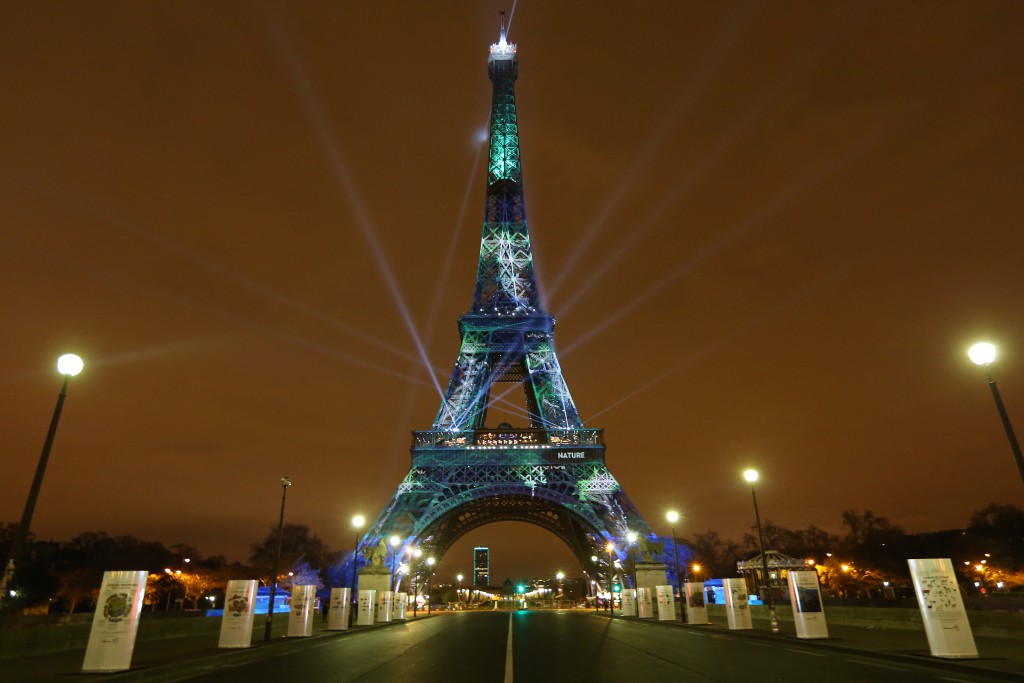 Eiffel Tower with projected trees by one heart one tree, an art work by one of the global citizens focused on climate change. (Image © Jean Philippe Pariente.)