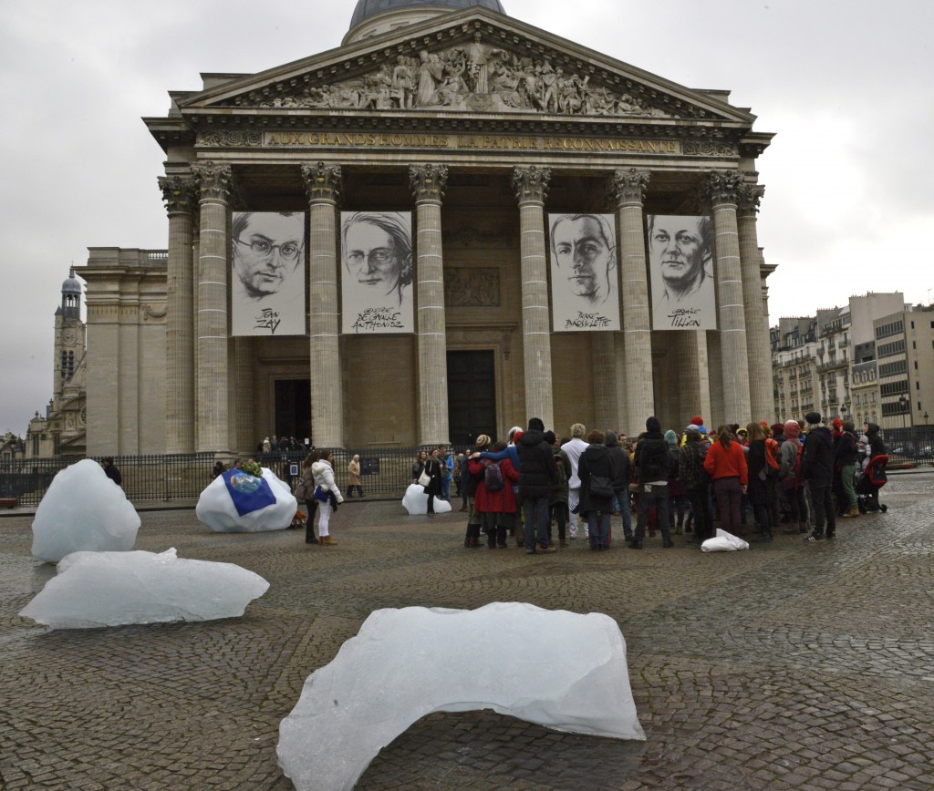 Protesters and ice installation at the Pantheon in Paris, an art work by one of the global citizens focused on climate change. (Image © Meredith Mullins.)