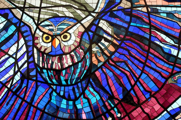 Flying owl in a stained glass panel from the wall of the Cosmovitral, a botanical garden and traveler's oasis in Toluca, Mexico. (Image © Odette Barron Villegas)