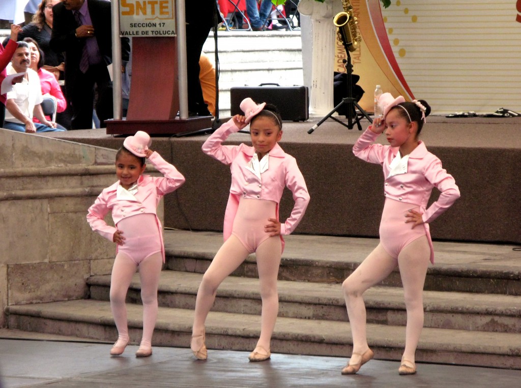 Young girls dressed in pink outfits dancing to jazz music, illustrating how Mexican dances can go across cultures. (Image © Eva Boynton)