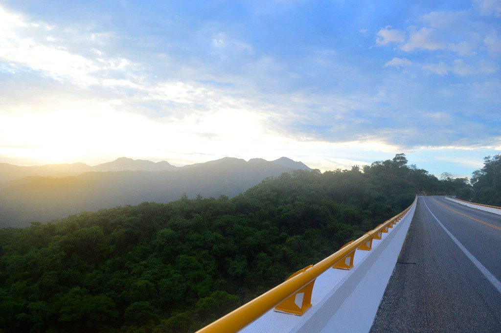 A Mexican toll road at sunset, illustrating how the survival essentials during adventure cycling can change perspective (Image © Gabriela Díaz Cortez)