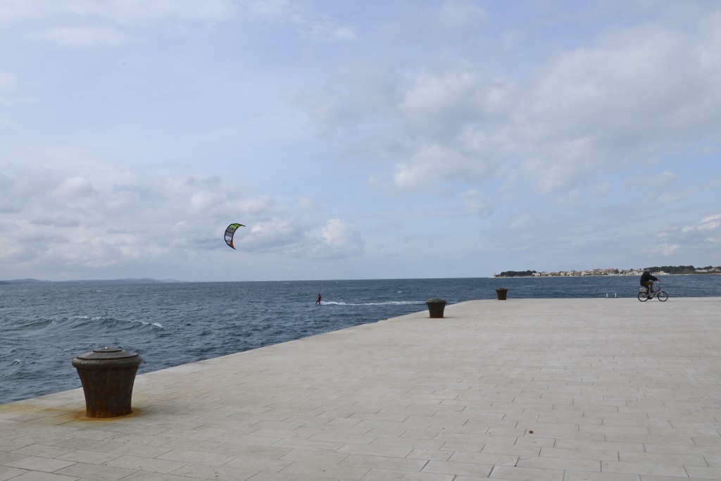 Wind surfer near the Riva in Zadar, Croatia, travel inspiration for travelers of all ages. (Image © Meredith Mullins.)