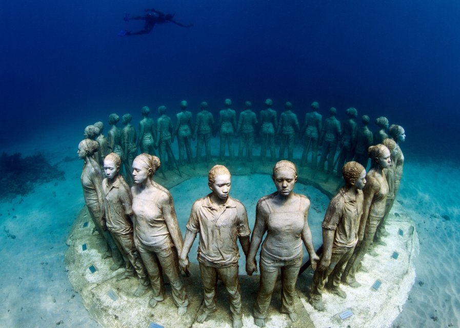 Sculptures of young people holding hands in a circle in the underwater museum off the coast of Grenada, an innovation by Jason deCaires Taylor. (image © Jason deCaires Taylor)