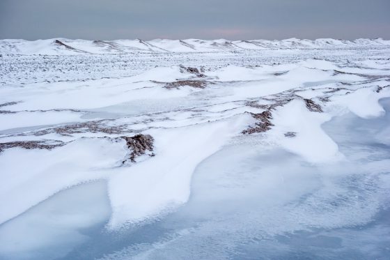 Frozen Long Point Beach in Canada, a virtual journey via landscape photography in celebration of Earth Day. (Image © Kathleen Pickard.)